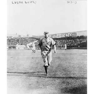   length, facing front, running on baseball field. P3407