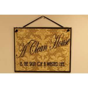 Black and Tan Sign Saying, A Clean House IS THE SIGN OF A WASTED LIFE 