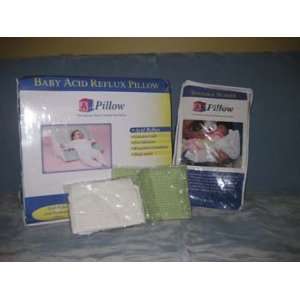  Pillow wedge with harness for 30 45 minutes after each feeding to help