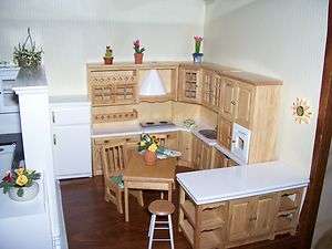   oak & white wood kitchen w/ upper cabinets fridge & island 1/12  
