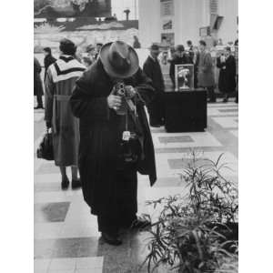 Visitor Taking Picture in Soviet Pavilion, Brussels Worlds Fair 