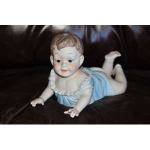   Baby Boy on Tummy Piano Bisque hand painted Figurine apx. 10 x 6.5