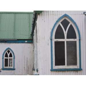 Details of a Church with Arched Windows and a Green Tin Roof Stretched 