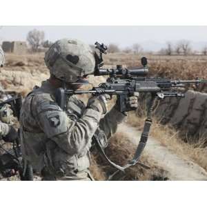 A U.S. Army Soldier Looks Through the Scope of His M 14 