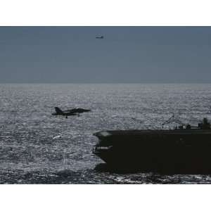  A Jet Comes in for a Landing on an Aircraft Carrier 