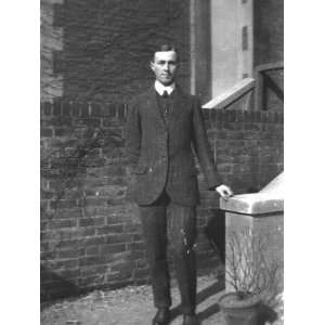  A Young Man Standing in Front of a Brick Wall in Southsea 