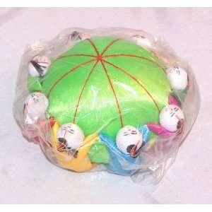   Green Pin Cushion with Kids Holding Hands Around 