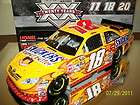 KYLE BUSCH 2011 #18 FLAMED SNICKERS PEANUT BUTTER SQUARED 124 ACTION 