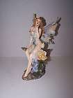 FRANKLIN MINT WINGED ANGEL FIGURINE SITTING ON ROCK WITH ROSES BLOWING 