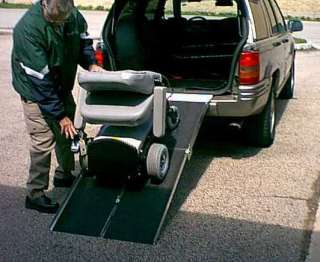 power wheelchair shown going into the back of a sport utiltiy vehicle