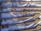   of antique curtain drapery rods with leaves and cherry finials has