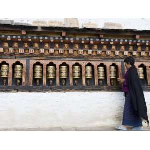 Bhutanese Woman Turning Buddhist Prayer Wheels, Trashi Chhoe Dzong 
