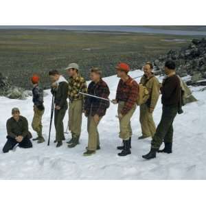 Scientists and Aircraft Crewmen Stand in Snow Near Arctic 