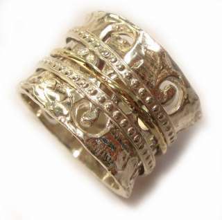 Silver and gold spinning wedding ring. The ring comprised of a main 