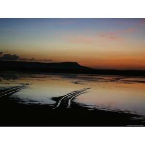  Twilight over a Mudflat with Vehicular Tire Tracks Premium 